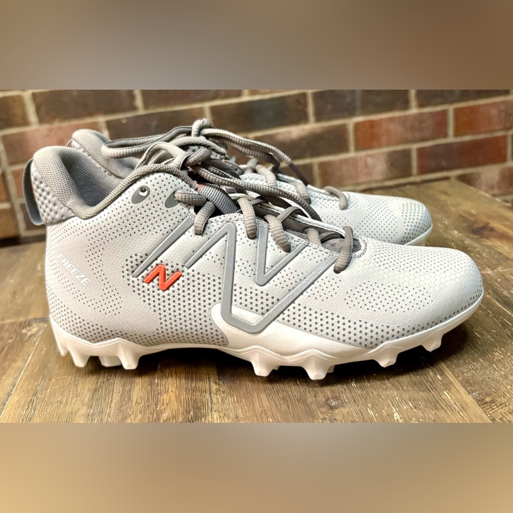 Kids New Balance FreezeLX v4 lacrosse cleats - grey and orange - Size 4.5